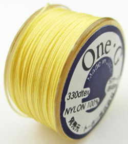 50 yard One-G TOHO bobbin of yellow nylon beading thread - 300 denier 