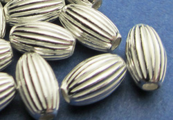  <17g/100> sterling silver 6.7mm x 4mm corrugated oval bead, 1.5mm hole 