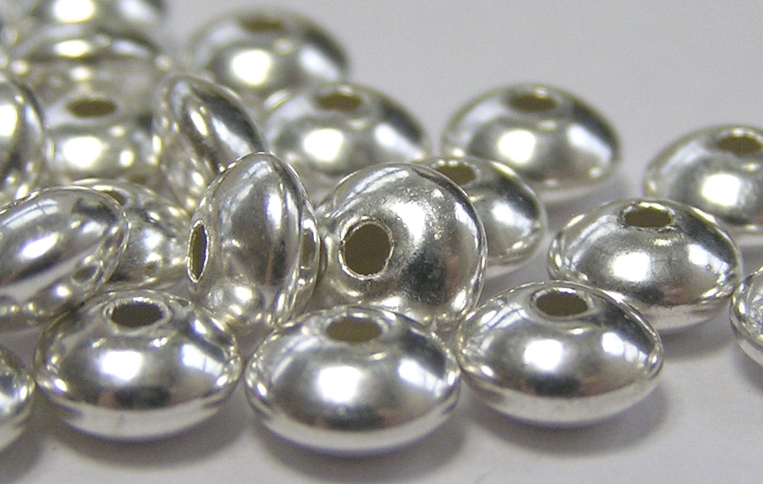  <18.35g/100> sterling silver 5.7mm x 3.2mm puffed circular disc spacer, 1.4mm hole 