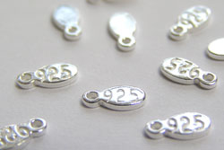  sterling silver, stamped 925, 6.25mm x 3mm x 0.8mm oval tag with integral 0.7mm hole 