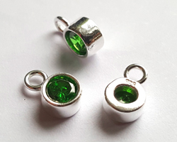  ** NEW LOWER PRICE ** sterling silver, stamped 925, 8.35mm x 5.15mm drop / charm containing a 4mm emerald green cubic zironia, very nicely made, has closed jumpring attached at the top with internal diameter of 1.5mm 