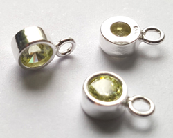 ** NEW LOWER PRICE ** sterling silver, stamped 925, 8.35mm x 5.15mm drop / charm containing a 4mm peridot green cubic zironia, very nicely made, has closed jumpring attached at the top with internal diameter of 1.5mm 