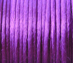  spool of approx 200 feet of purple bugtail - multistranded satin - approx 1mm thick 