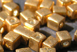  grams of gold miyuki shoji 4mm cube bead - sold per gram - aprox 10 beads per gram (pp12g) 