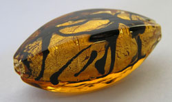  venetian murano topaz glass with black veins over 24k gold foil 30mm x 12mm x 12mm squared edge oval bead *** QUANTITY IN STOCK =1 *** 