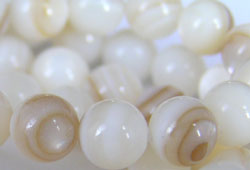  one string of oyster shell 5mm round beads - approx 90 beads per string 