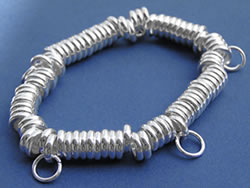  silver plated elasticated sweetie bracelet, with open jumprings attached ready to add charms 