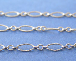  cm's - SOLD IN METRIC LENGTHS -  sterling silver 7.5mm oval + 2mm round long & short textured antiqued chain, long links are 7.5mm x 3.5mm,  short links are 2mm, there are x3 short links dividing the long links - sold per inch 