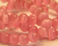  string of pink cats eye 4mm round beads - approx 100 per string 
