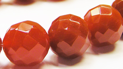  strand of carnelian 10mm faceted round beads - approx 36 beads per strand 