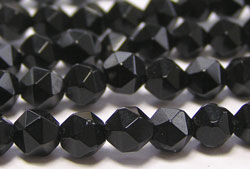 short strand of black onyx 6mm faceted oval beads - approx 33 beads per strand 