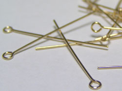  gold fill half hard, 24 gauge (approx 0.5mm thick) 25mm eyepin, ring at end has 1mm internal diameter 