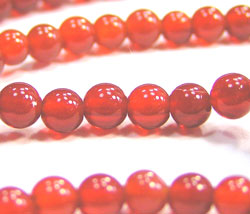 string of red carnelian 4mm round beads - approx 100 per string