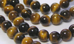  1/2 string of tigers eye, 6mm round beads - approx 30 beads per strand 