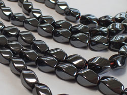  LOOSE BEADS :  hematite 9mm x 6mm twisted oval beads 