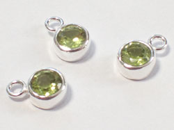  sterling silver, stamped 925, 8.75mm x 5.5mm peridot drop / charm, very nicely made, has closed jumpring at top with internal diameter of 1.5mm,  