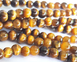  --CLEARANCE--  half string of tigers eye 4mm round beads - approx 45 per strand 