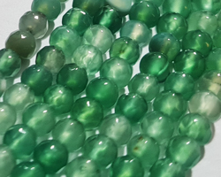  string of mostly green with a few browns agate faceted 4mm round beads - approx 90 per strand 