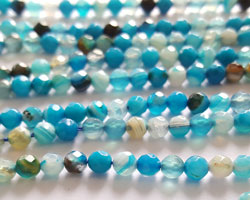  string of mostly blue with a few browns agate faceted 4mm round beads - approx 90 per strand 