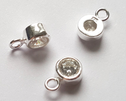  sterling silver, stamped 925, 8.35mm x 5.15mm drop / charm containing a 4mm crystal clear cubic zironia, very nicely made, has closed jumpring attached at the top with internal diameter of 1.5mm 