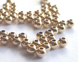  gold filled, 12/20, 2.5mm round bead - 1.1mm hole - these beads are 12/20 not 14/20 and so are a very slightly paler colour than 14/20 